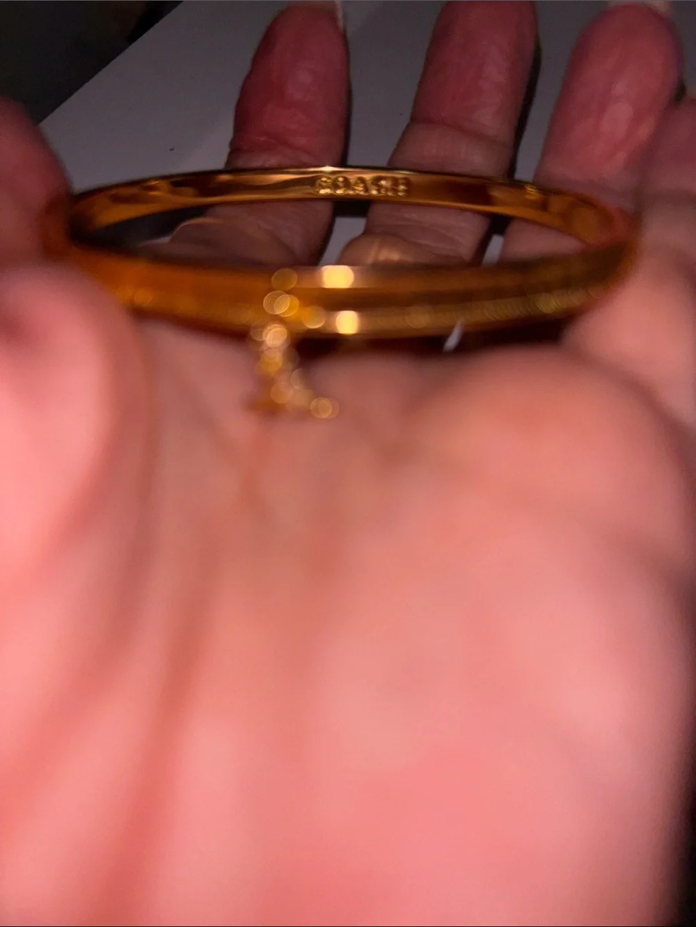 Coach Gold-Tone Textured Bangle with Star Crystal Accent Rexy